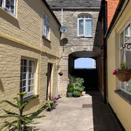 Photograph of the front archway onto Bow Street.