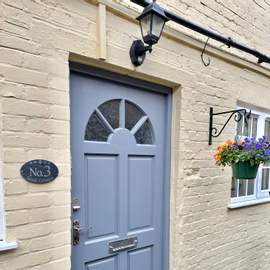 Photograph of the front door of Number 3. Our newly refurbished 2/3 bedroom character cottage.